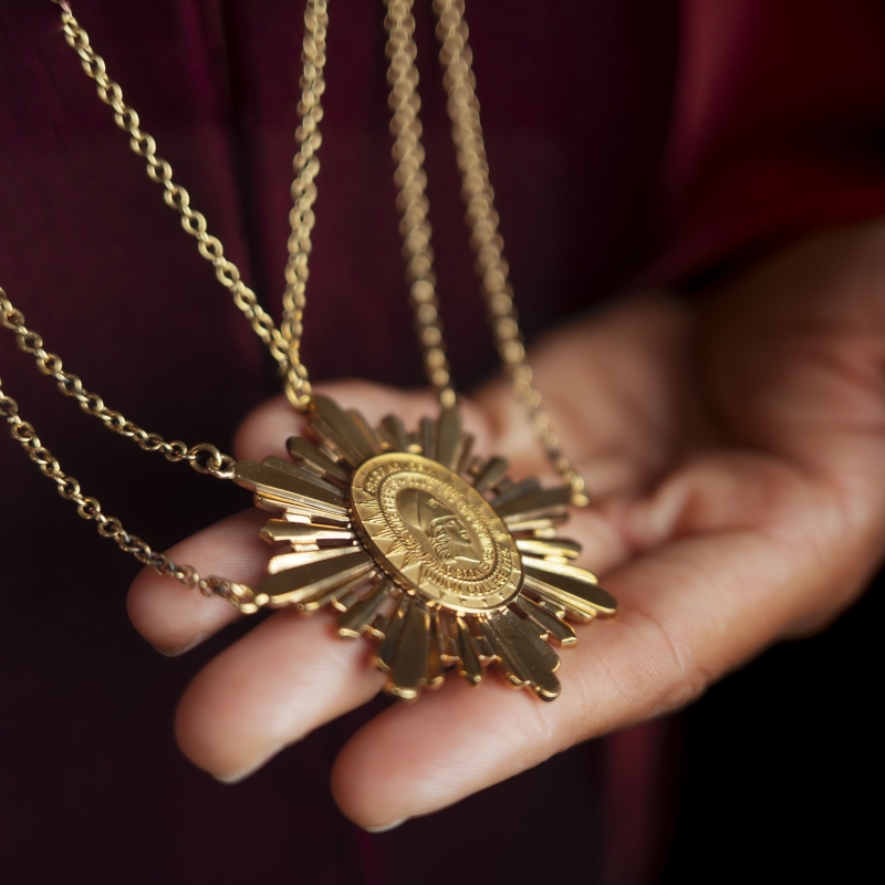 President David Harris holds the presidential medallion