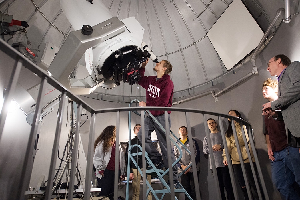 A student looking through the observatory telescope.