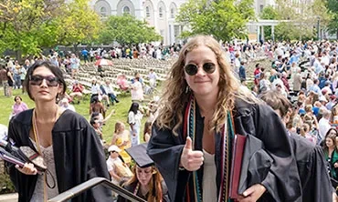 Students process into the Nott Memorial carrying their diplomas.