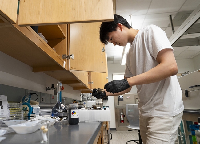 In a lab in the integrated Science and Engineering Complex, Young Jun Chun '25, a biomedical engineering major from Seoul, South Korea, aims to characterize efficient reduction methods or combinations of reduction methods that will result in enhanced antibacterial properties of reduced graphene oxide from graphene oxide.
