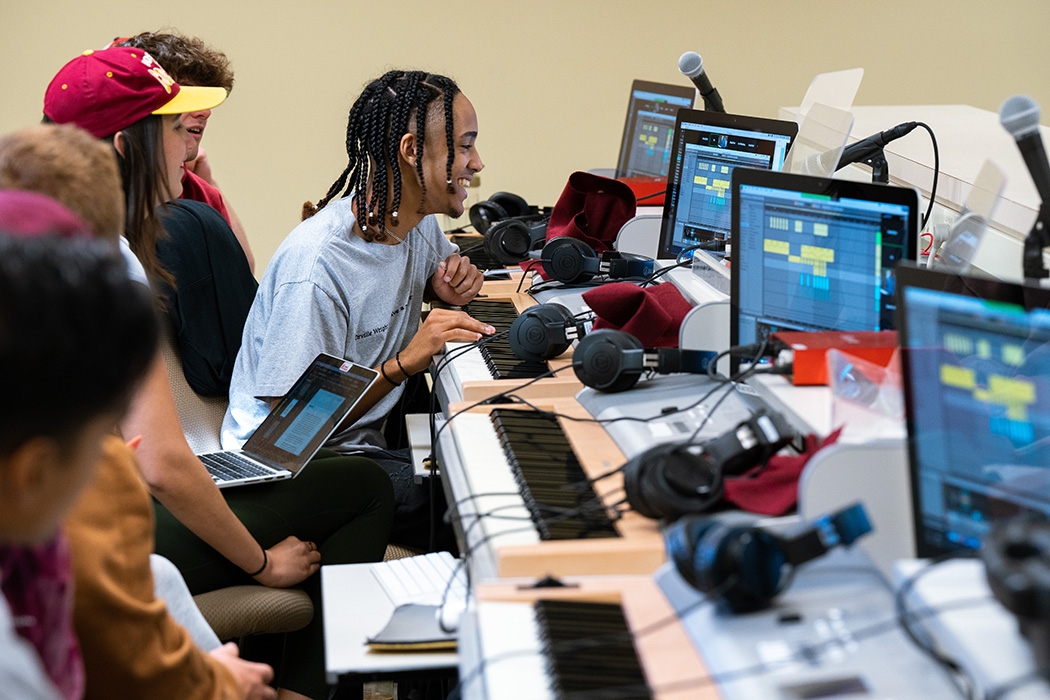 Students look at monitors while participating in a digital music class held in one of the Taylor Music Center classrooms.