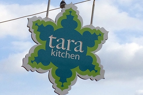 The Tara Kitchen sign that hangs outside the restaurant