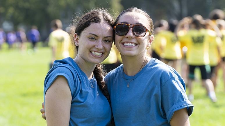 Two students that participated in field games pose for the camera.