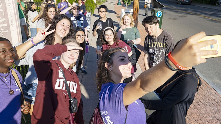 Students talking a selfie while in downtown Schenectady.