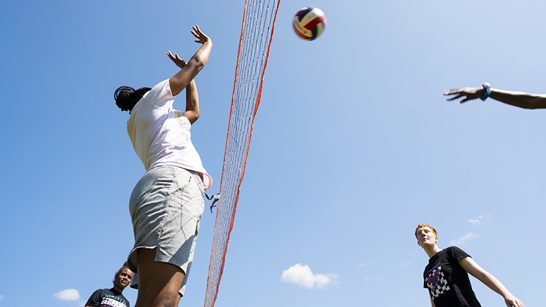 Volleyball players having fun at a college-sponsored event.