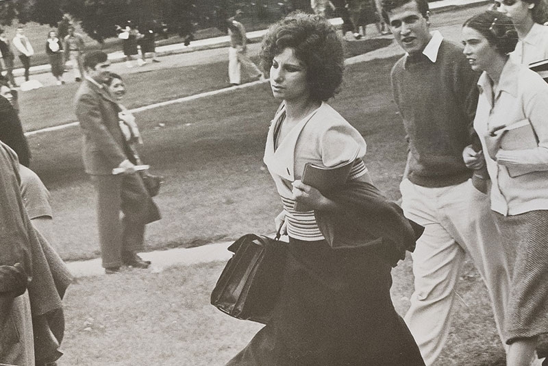 Barbara Streisand walking on the Union campus during filming