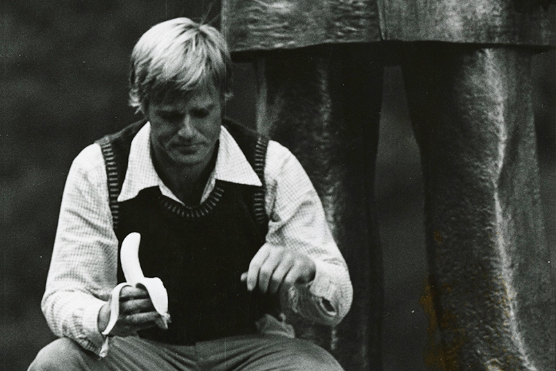 Robert Redford snacks on a banana between filming takes