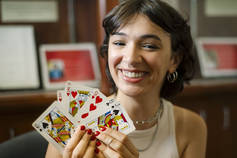 A student show playing cards used as part of her research