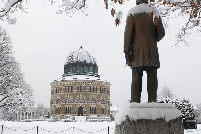  A snowy day view of the Nott Memorial, with the back of the Chester Arthur statue visible in the foreground.