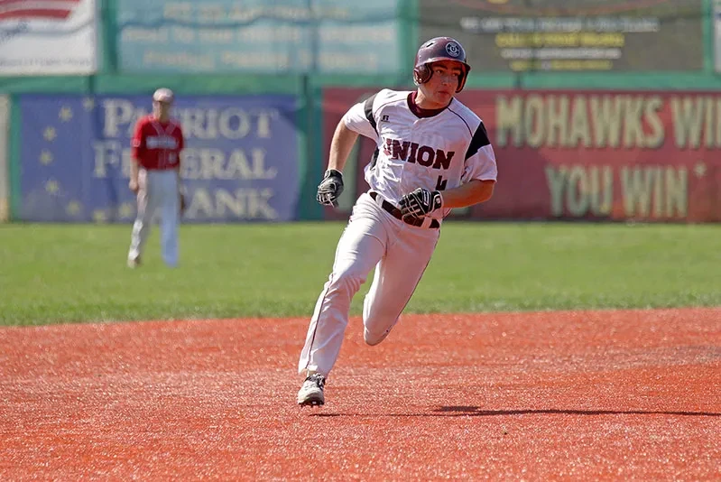 A baseball player rounding the bases.