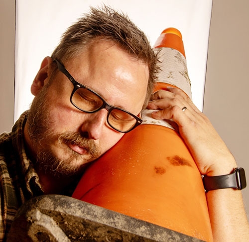 Frank Rapant '07, self-portrait with road cone.