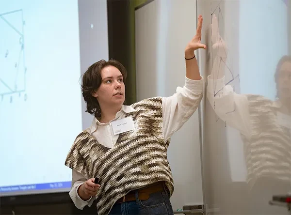 Mathematics major Emily Vasquez ’24 started preparing for her presentation weeks ago. She didn’t know quite what to expect. She had never given a public presentation related to math. Also, the topic, “Finding the Relationship Between Triangles and the Pythagorean Theorem using Calculus,” could be challenging for those who would rather forget the fundamental principle of geometry taught in high school: a² + b² = c².