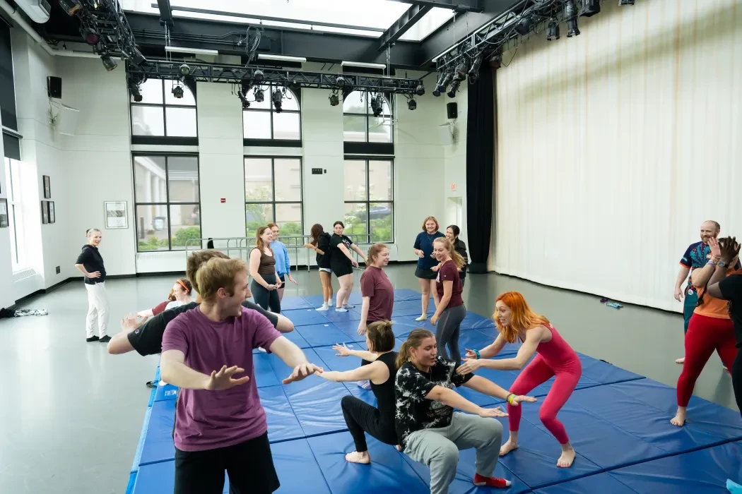 Students take circus arts workshop.