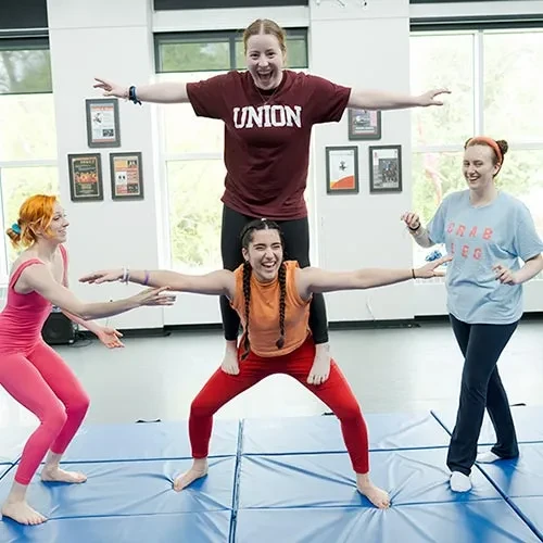 Students engaged in acrobats in Henle Dance Pavilion
