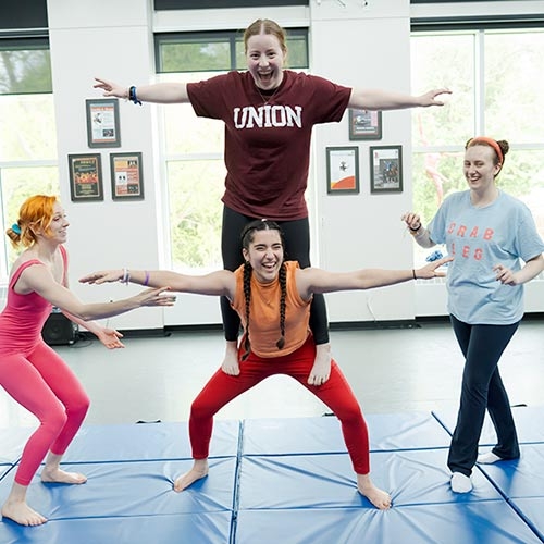 Students engaged in acrobats in Henle Dance Pavilion