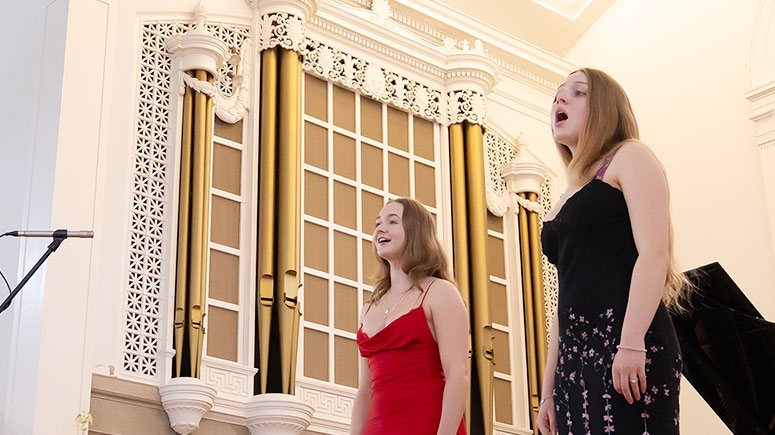 Two students perform a song in Memorial Chapel during Founders Day celebrations