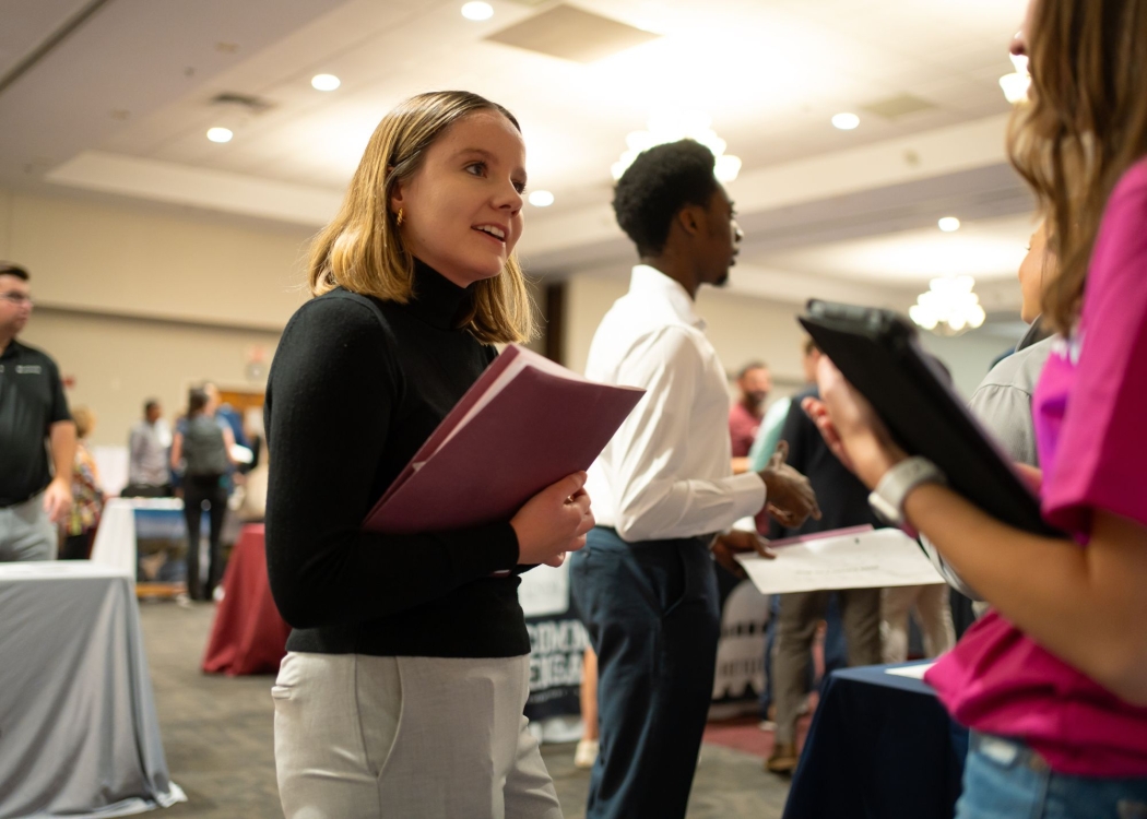 Student networking at a career fair