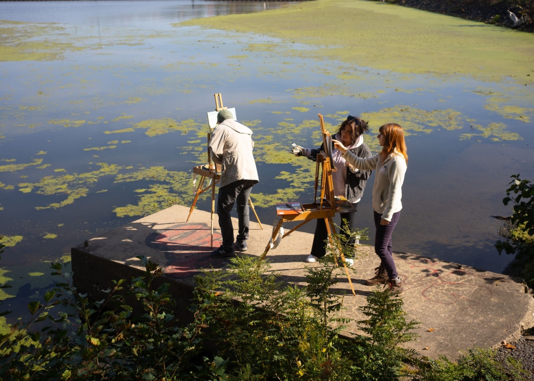 Students painting along the Erie Canal