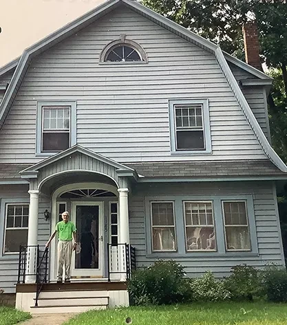 Robert McFarland outside his Schenectady home