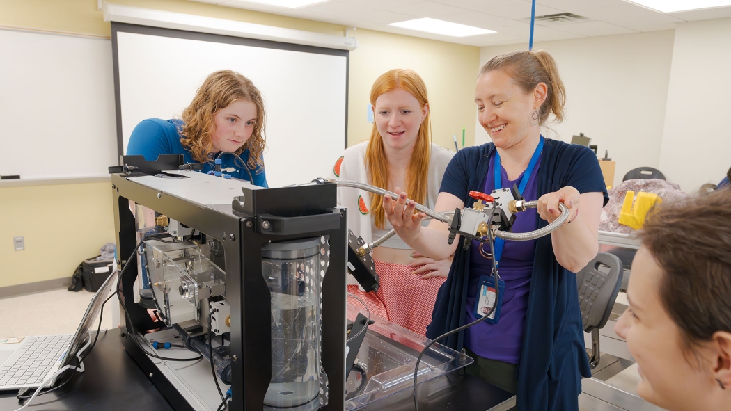 Union College civil engineering professor Carolyn Rodak reviews project requirements with three attentive students.