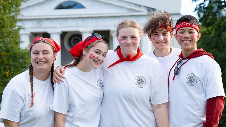 Five students standing in front of Memorial Chapel