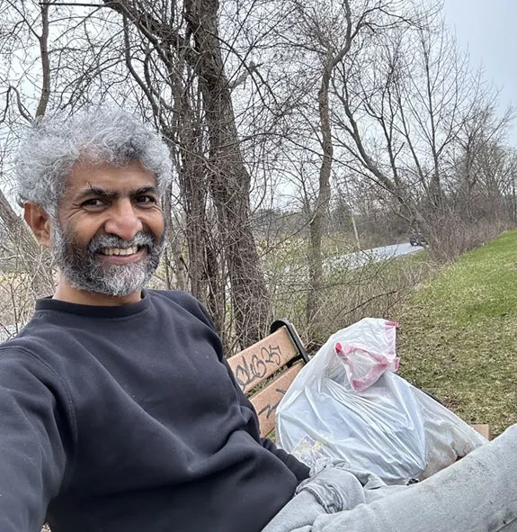 Ashok Ramasubramanian helps during a trash pickup event along the Mohawk-Hudson Bike Hike Trail.