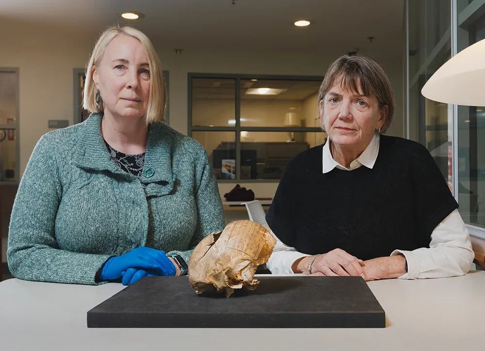 Sarah Schmidt, director of Special Collections and Archives at Schaffer Library and Frances&nbsp;Maloy, College librarian, with the partial skull.