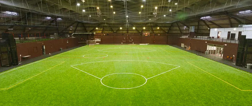A view of Brooks Field from the perspective of a net,
