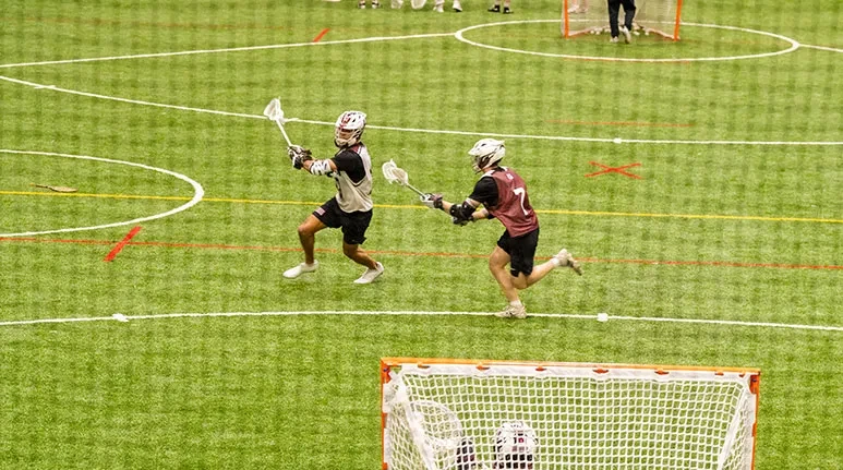 Students playing on the turf field