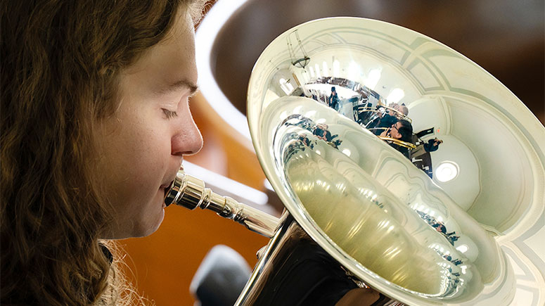 A student plays the tuba