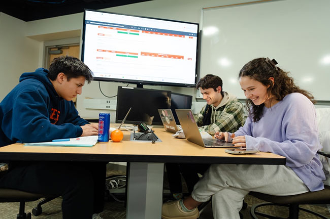 Students Francesco Ciaramitaro '28&nbsp;, Chris Wearing '26 and Lu De Azevedo ‘27 compete in a recent Microsoft Excel Collegiate Challenge from the Peter Irving Wold Center.