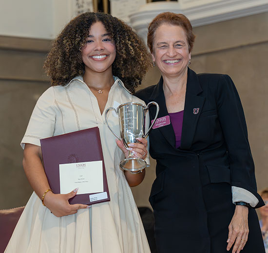 President Elizabeth Kiss presents Dani Brown ’26 the Frank Bailey (1885) 