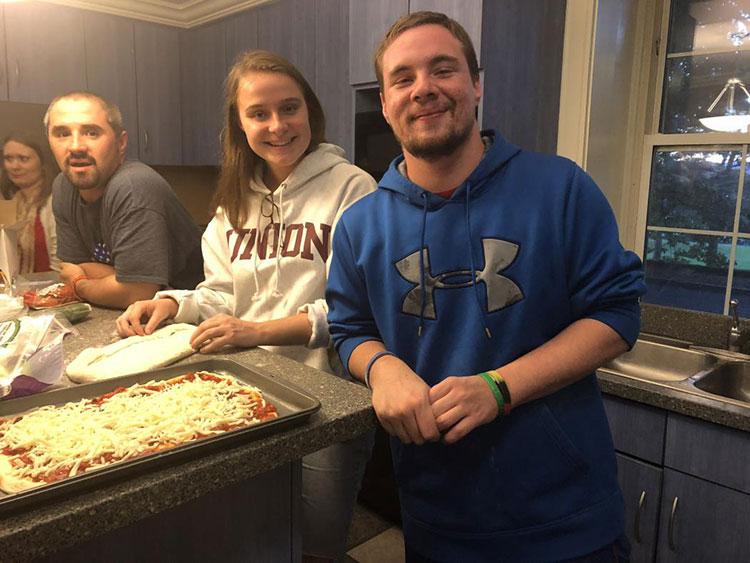 Students prepare pizza as part of the Good Eats program