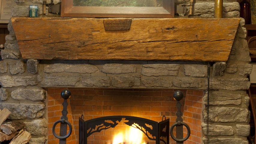 ARL Facilities 6 Stone fireplace with bench.
