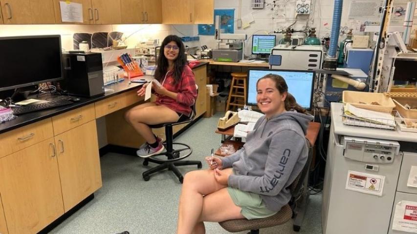 Sienna conducting laboratory analysis on campus with her research partner.