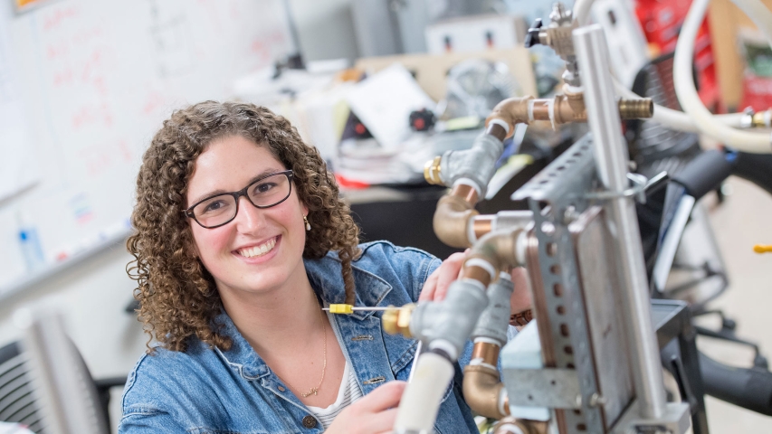 A student in one of the engineering labs