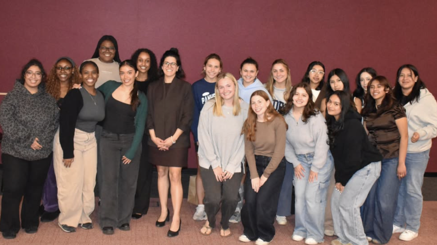 AM Gabriella Romero '14 with students