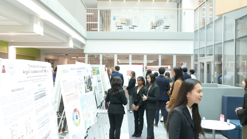 Students presenting and networking at the 1st annual Combined Degree Student Research symposium in ISEC Atrium