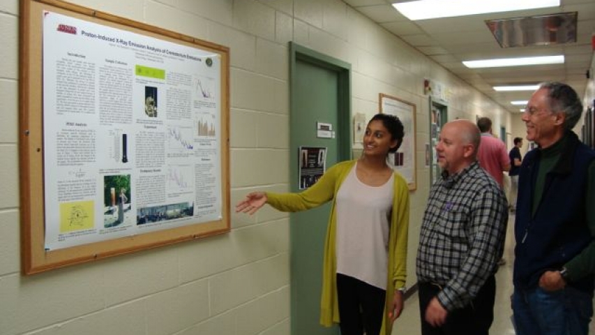 Salina worked with Scott Labrake (center) to trace elements in aerosol samples.