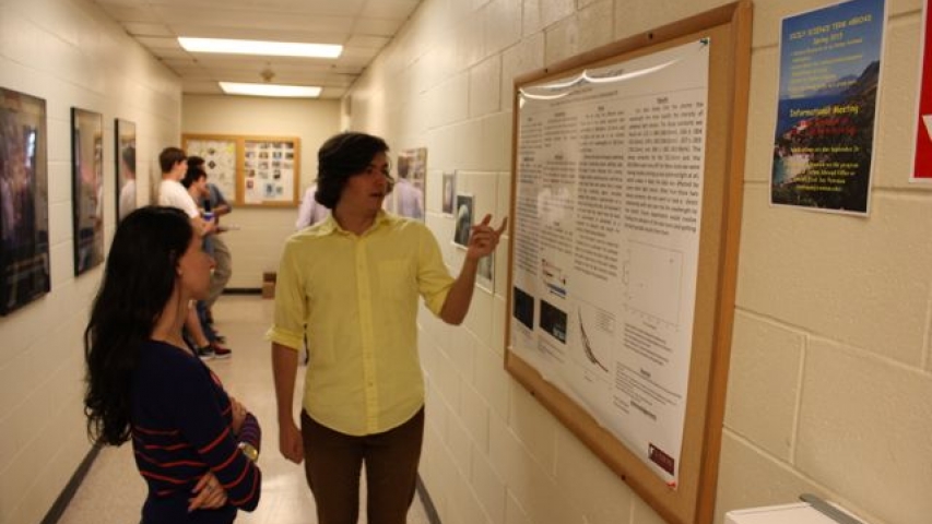 Brian explains his summer project to Rachel.