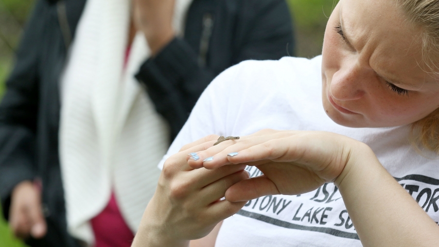 Tacia Angelopoulos '18 with a brown snake