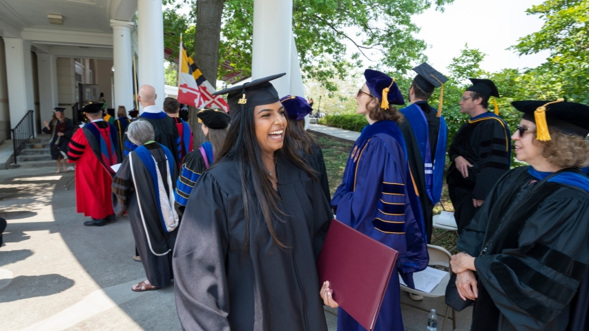Students line up to receive their diplomas.
