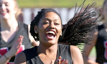 Women's track team celebrate a victory 