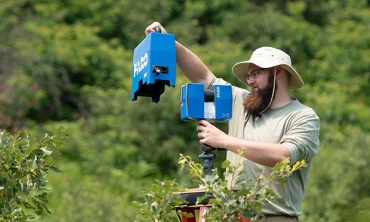 Sean Rigney ’20 uses a terrestrial laser scanner to collect 3D images of the shrub structure in the Albany Pine Bush Preserve. Working with Steve Rice, professor of biology,