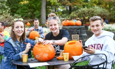 Families enjoy pumpkin carving