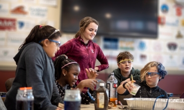 Union students work with girls and boys and in grades 4-6 as mpart of the Junior Science Program.