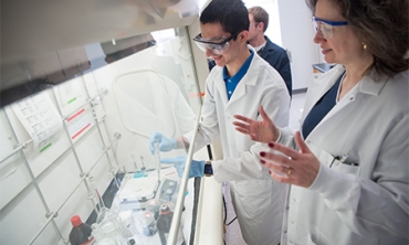 Mary Carroll ’86, the Dwane W. Crichton Professor of Chemistry in the aerogel lab with a student.