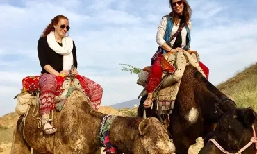 Union students on a study abroad program riding camels