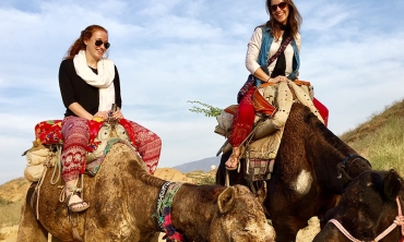 Union students on a study abroad program riding camels