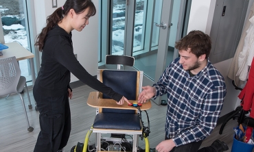 Engineering students Yueyin Su and Benjamin Davis collaborate on the replicable power wheelchair.